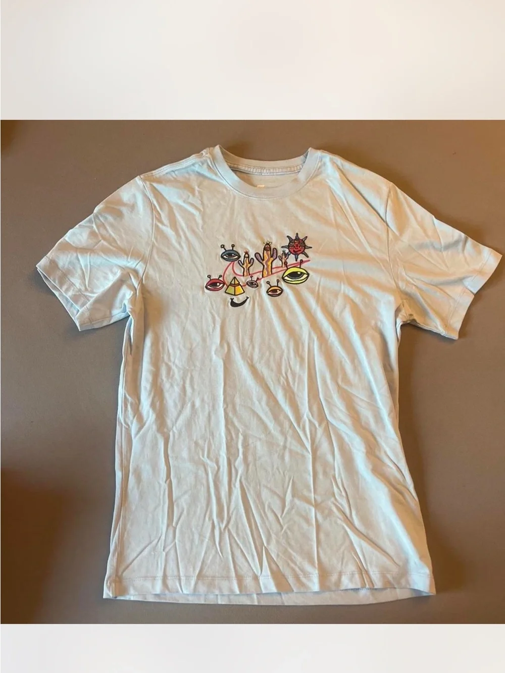 Nike White Short‑Sleeve Tee with Multicolor Eye Graphic